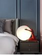 Modern Art Table Lamp Red Abstract Humanoid Holding LED Light Ball Online Hot Sale